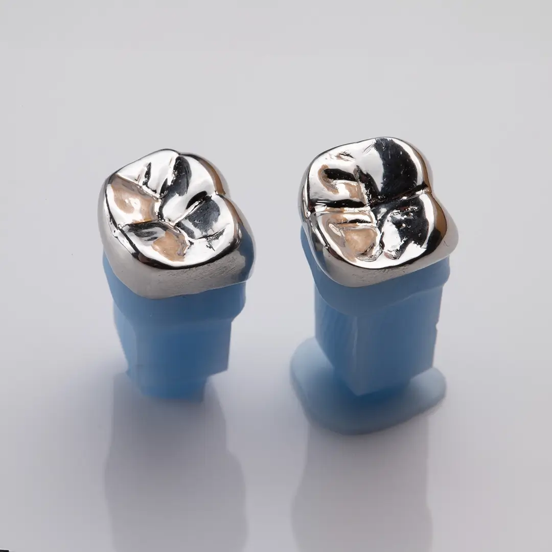 An Image Of Two Metal Crowns
